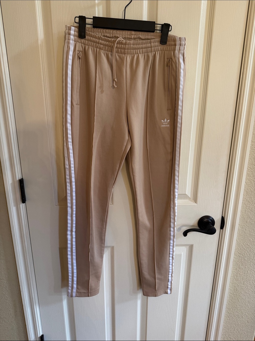 Adidas Women’s track pants. Size small beige color. Like new!